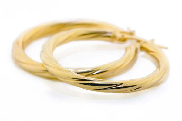 Guld smycken - örhängen Royaltyfria Stockbilder