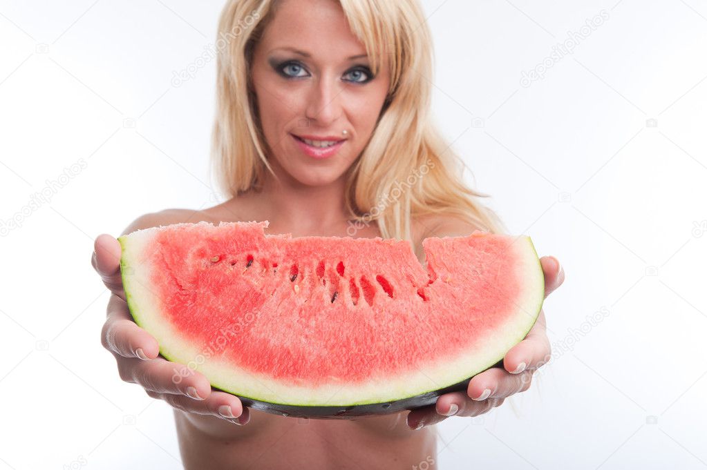 Blond woman offering watermelon