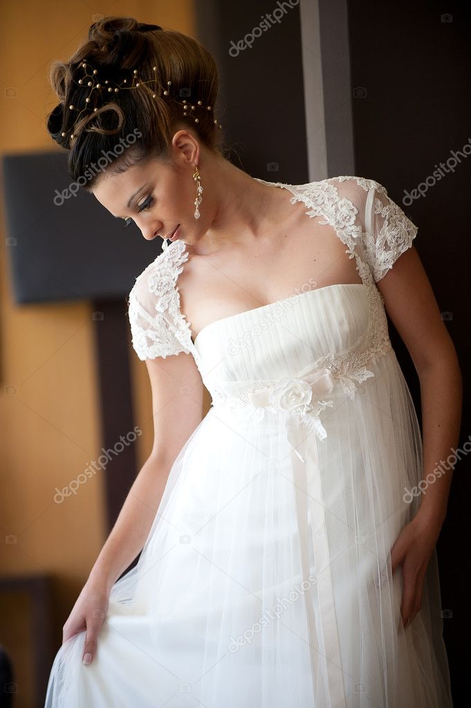 Young bride posing looking down