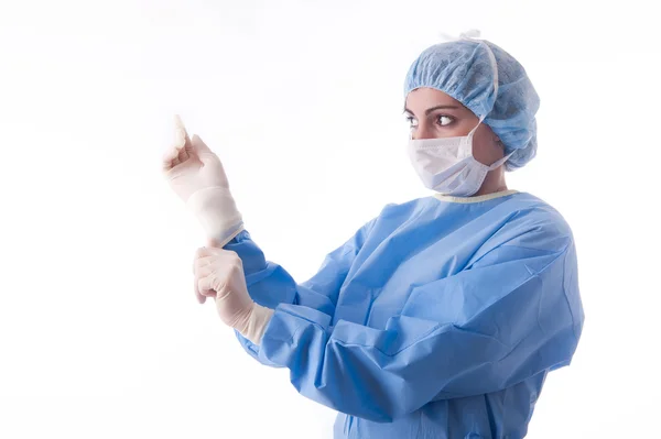 Female surgeon or nurse putting on sterile gloves — Stock Photo, Image
