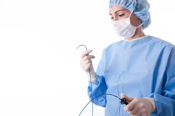 Female doctor or nurse holding a catheter — Stock Photo, Image