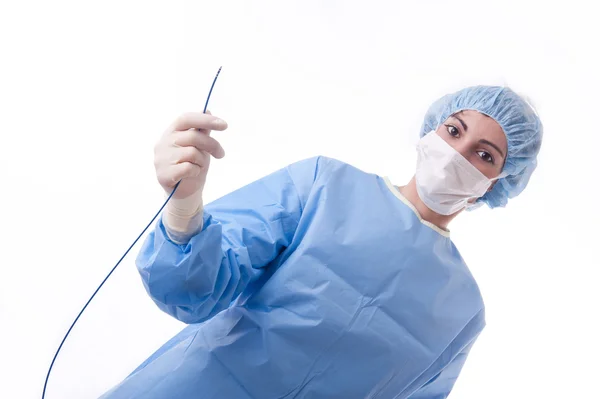 Médico o enfermera que sostiene un catéter Imagen de archivo