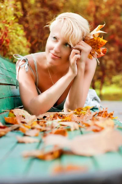 Women with autumn leafs — Stock Photo, Image