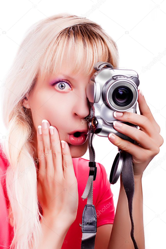 The surprised girl takes a picture