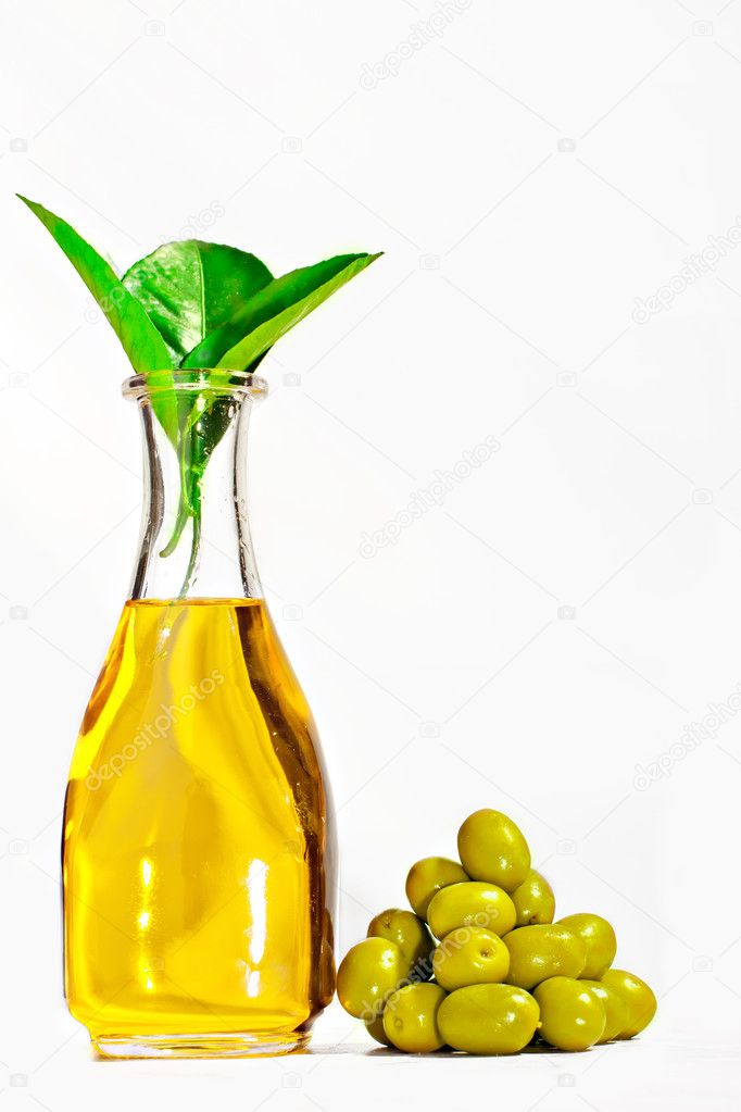Olive oil in the bottle with olives