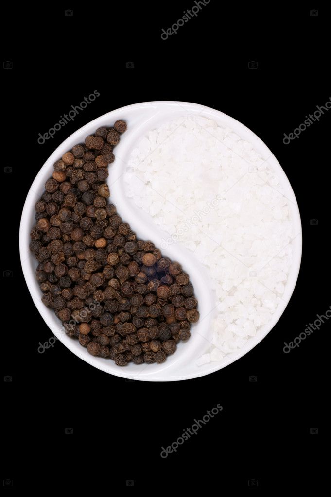 Black pepper and salt on a black background — Stock Photo © lev1977