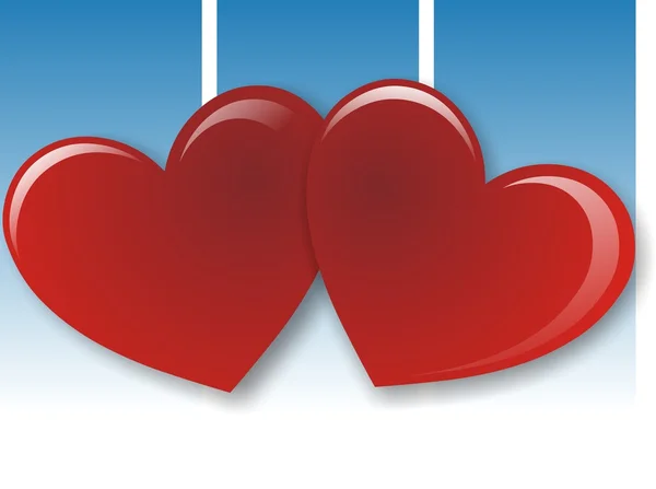 Dois corações vermelhos no fundo azul — Fotografia de Stock