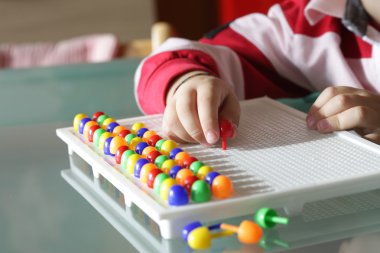 Child playing close up hands