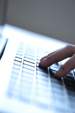 Young boy using a keyboard