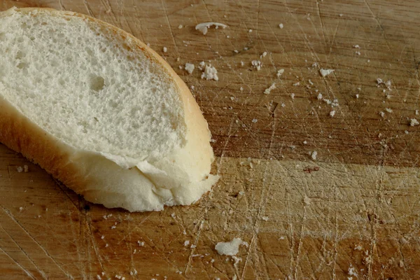 stock image Fresh sliced bread on a wooden plate