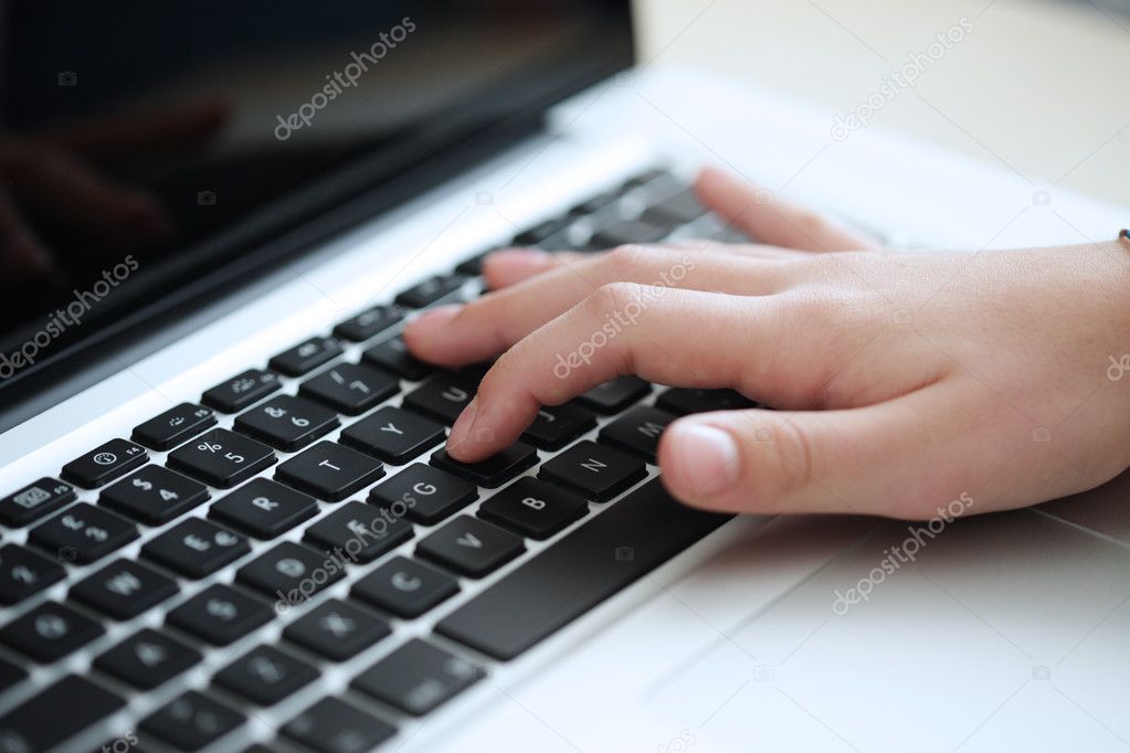 Young boy using a keyboard