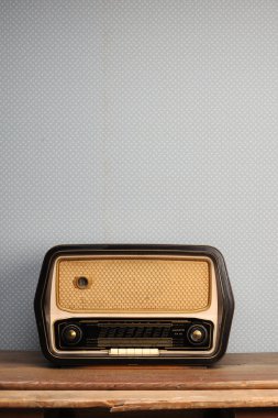 Antique radio on vintage background clipart