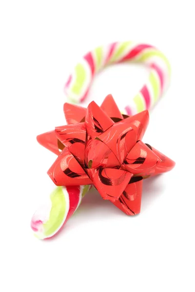 Candy cane with red bow — Stock Photo, Image