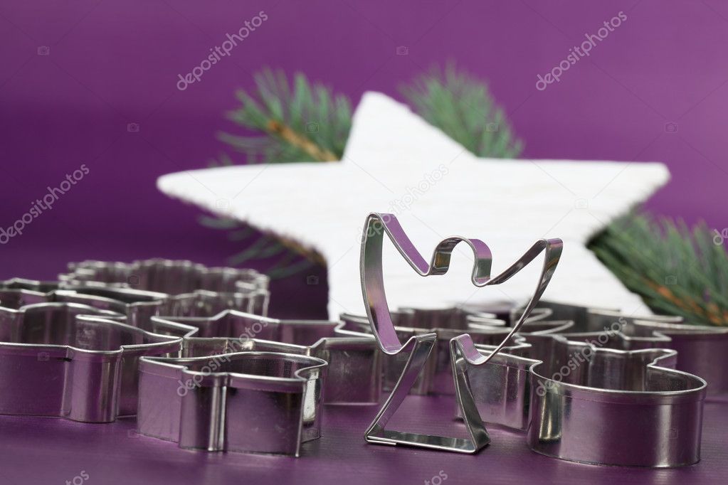 Angel cookie cutter on Christmas background