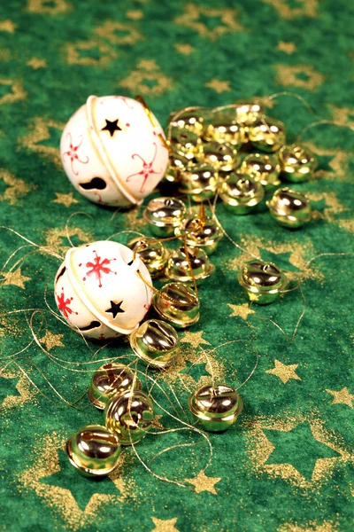 Jingle bells on green background — Stock Photo, Image
