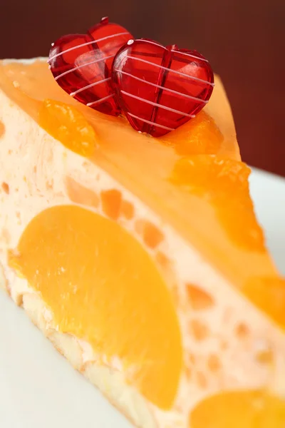 Peach mousse with tangerines and hearts — Stock Photo, Image