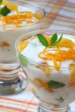 Mint yogurt dessert with oranges clipart