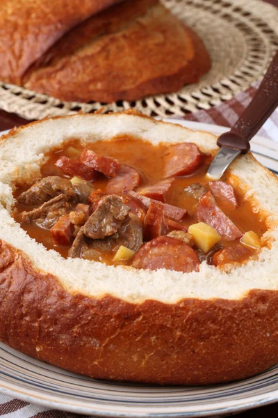 Goulash soup in a bread bowl — Stock Photo, Image