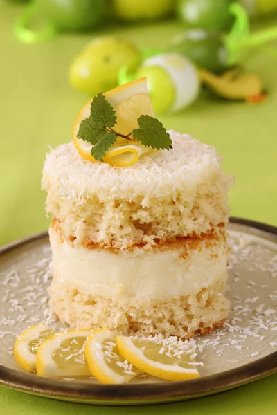 Coconut and lemon cake with Easter eggs — Stock Photo, Image