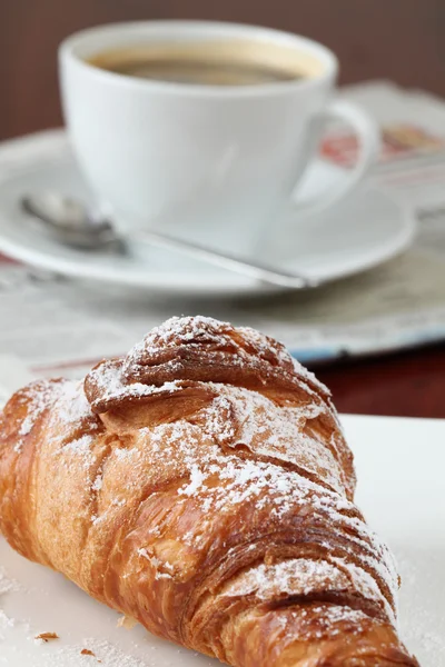 Croissant, coffee and newspaper — Stock Photo, Image