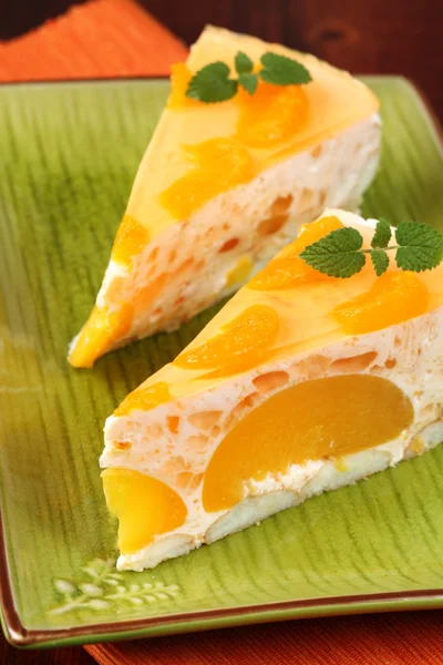 Peach mousse with tangerines — Stock Photo, Image