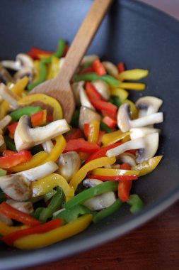 Fried bell peppers and mushrooms clipart