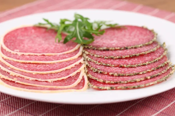 Salami with parmesan and pepper crust — Stock Photo, Image