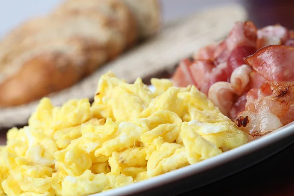 stock image Scrambled eggs and bacon