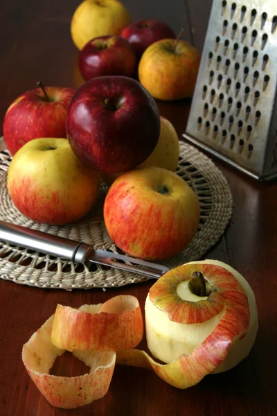 Apples with peeler and grater — Stock Photo, Image