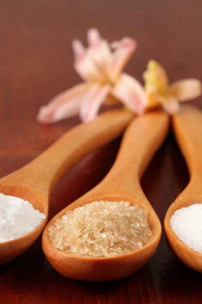 Sugar in wooden spoons — Stock Photo, Image