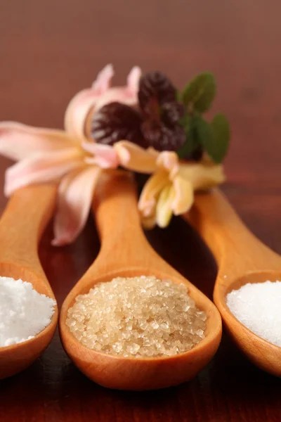 Sugar in wooden spoons — Stock Photo, Image