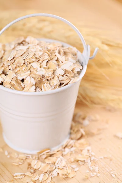 Oats in a small bucket — Stock Photo, Image