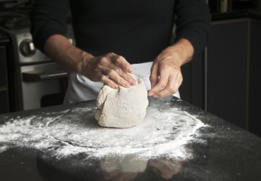 Woman Kneading Dough clipart