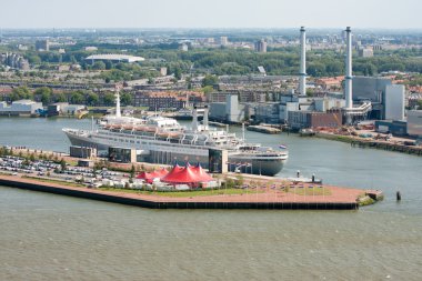 Aerial view of Dutch harbor Rotterdam with a big passenger ship clipart