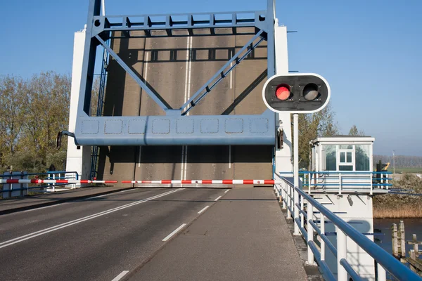 Opened bascule bridge in the Netherlands with red stop sign — Stock Photo, Image