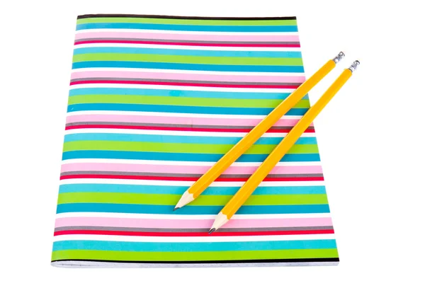 Colorful exercise book with wooden pencils — Stock Photo, Image