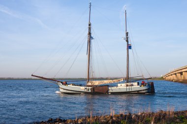 Salingship passing a bridge in the Netherlands clipart