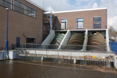 Pump house for watermanagement in the Netherlands clipart