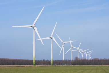 Dutch rural landscape with windturbines clipart