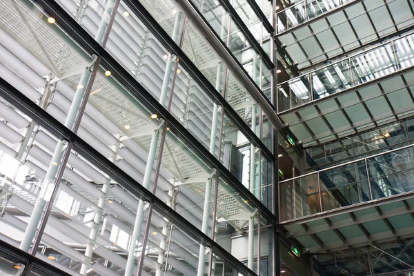 Interior of a modern building with lots of steel and glass — Stock Photo, Image