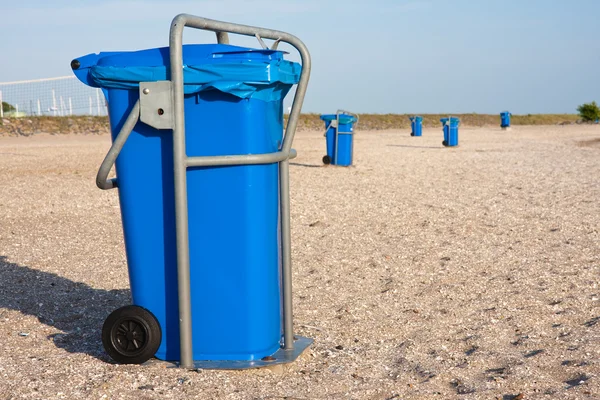 stock image Big blue dust bins at the beach