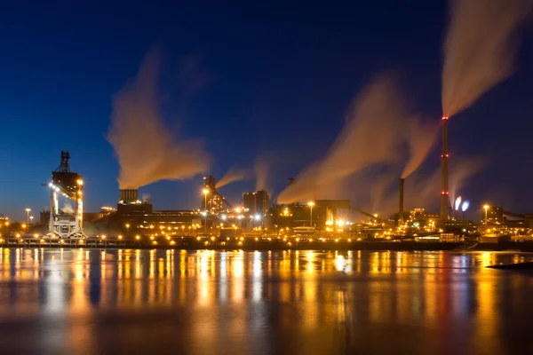 Dutch steel factory with smokestacks at night — Stock Photo, Image