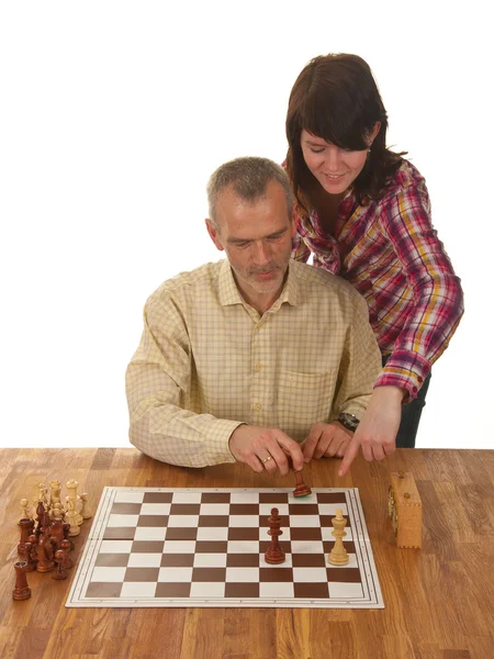 A girl is learning her father how to checkmate the enemy king — Stock Photo, Image