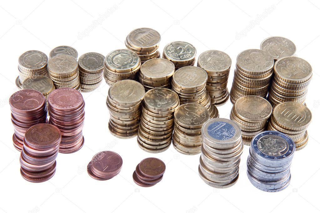 Several piles of european coins on a white background