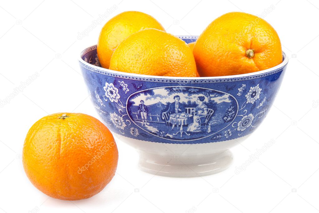 Oranges in a ancient hand-painted bowl