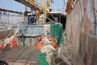 Dutch Fishing ship with drying nets at the deck clipart