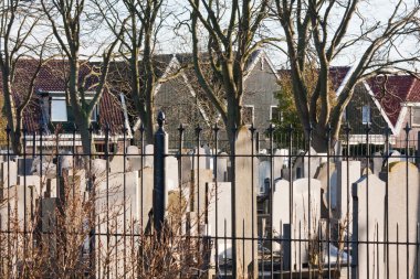 Graveyard in the middle of fishing village Urk, the Netherlands clipart