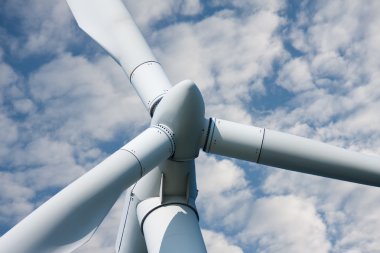 Windmill against a cloudy sky clipart