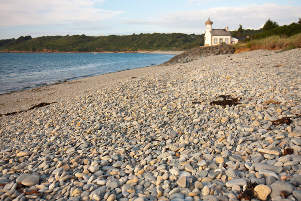 Beach with many coloured pebbles in France