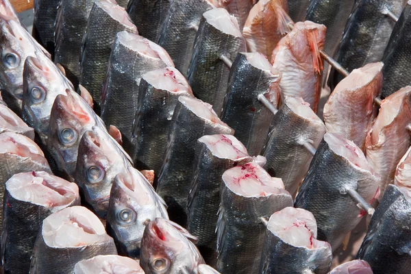 Spit with fish, prepared by smoking — Stock Photo, Image